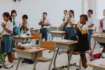 children in school uniforms in classroom