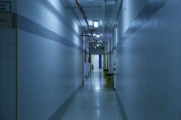 white tiled hallway